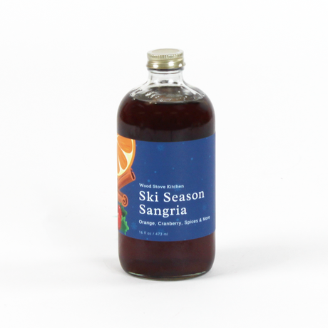 Bottle of 'Ski Season Sangria' with a blue label on a white background