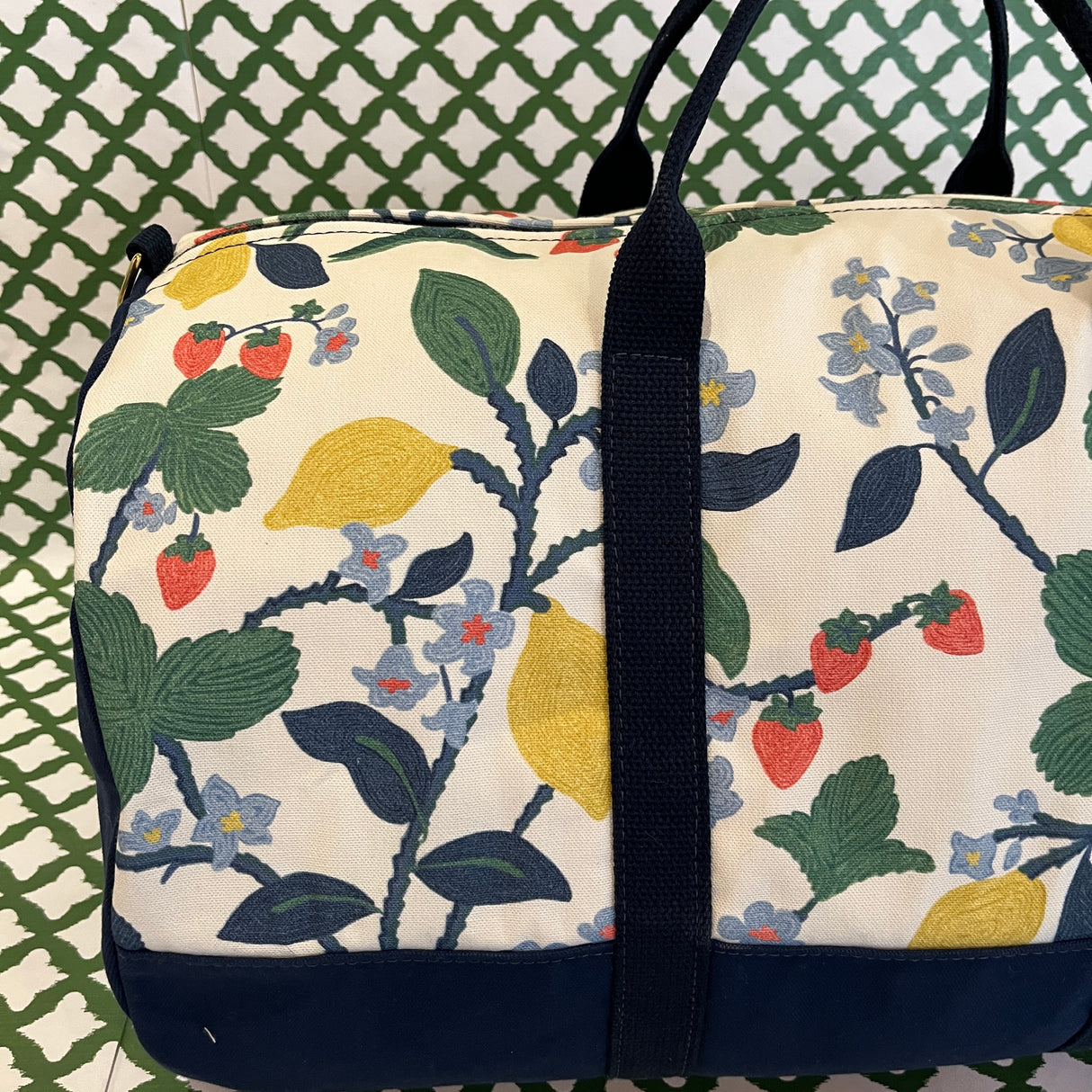 Close-up side view of the Strawberry Hill canvas duffle bag