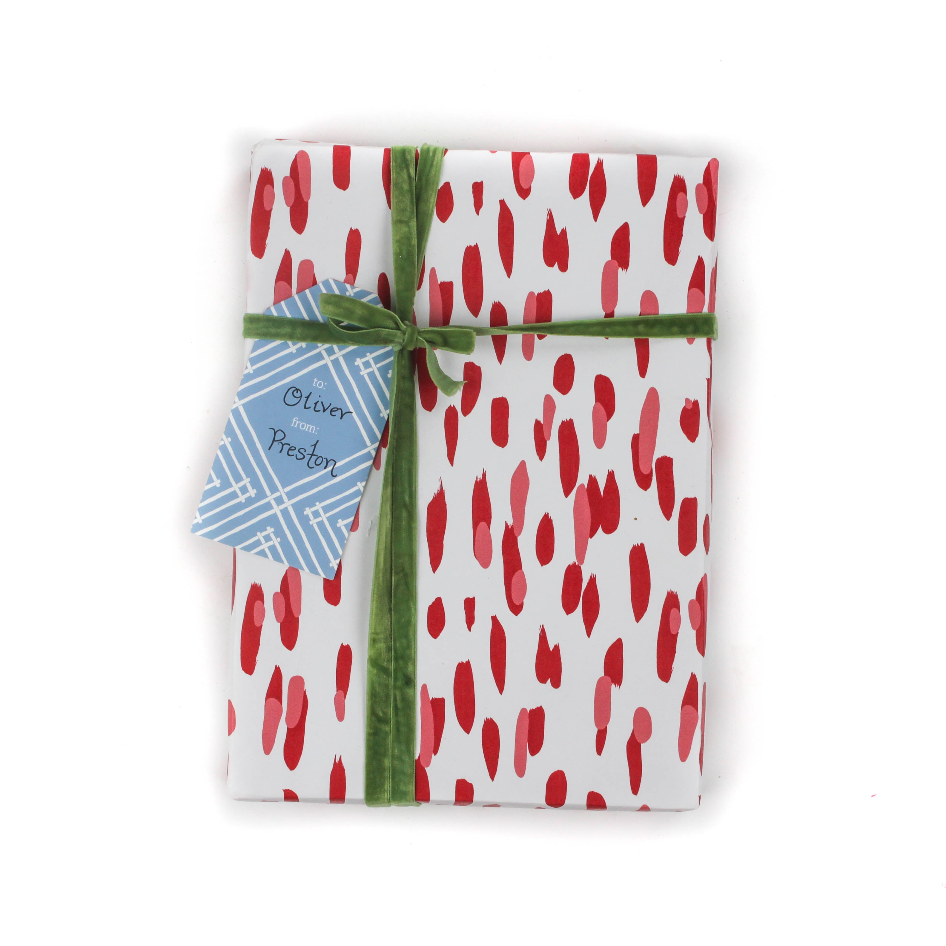A wrapping paper in painterly patterns and red in color.