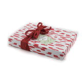 A wrapping paper in painterly patterns and pink in color.