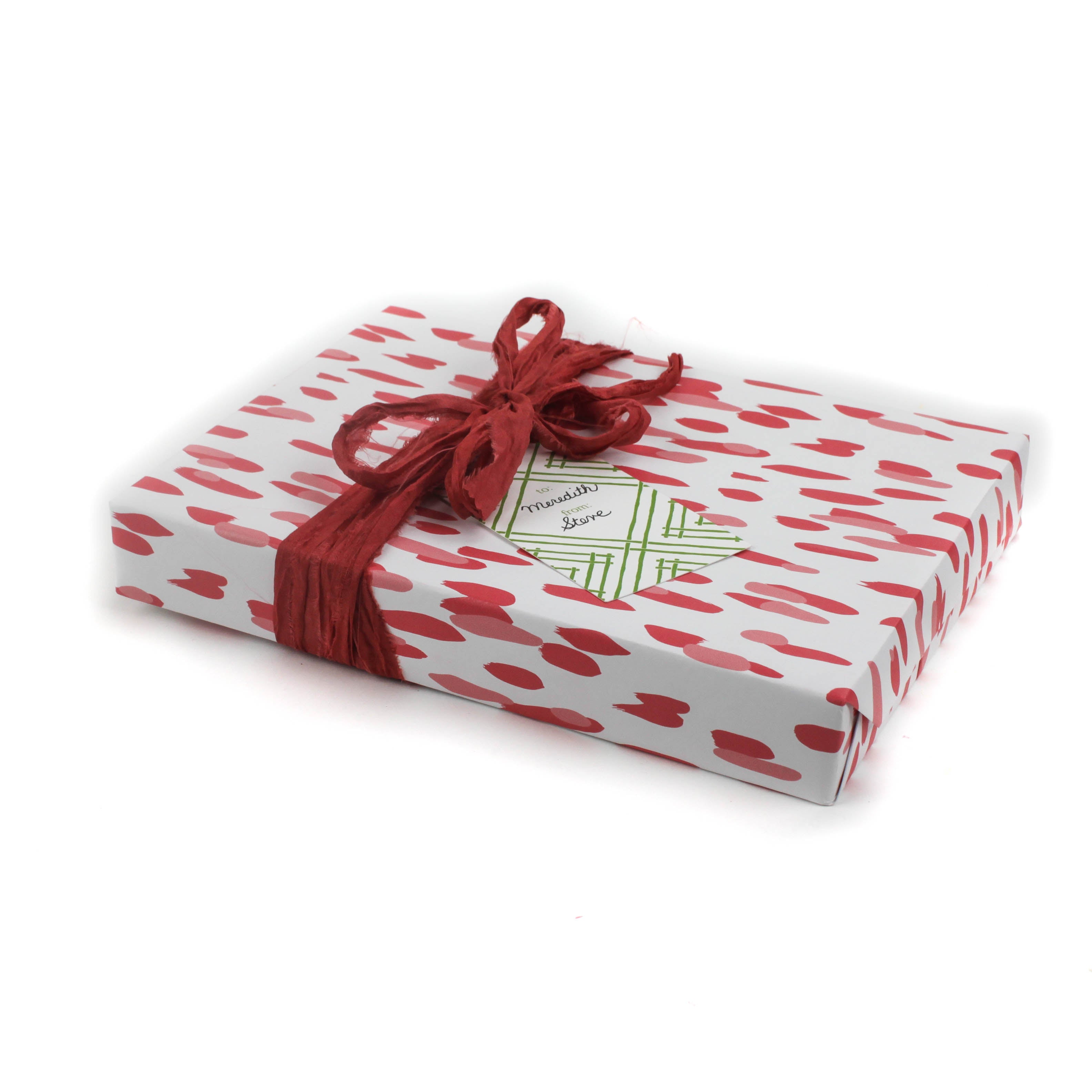 A wrapping paper in painterly patterns and pink in color.