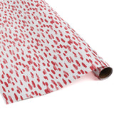A roll of wrapping paper in painterly patterns and pink in color.