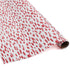 A roll of wrapping paper in painterly patterns and pink in color.