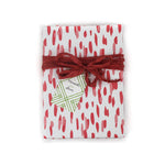 A wrapping paper in painterly patterns and pink in color.