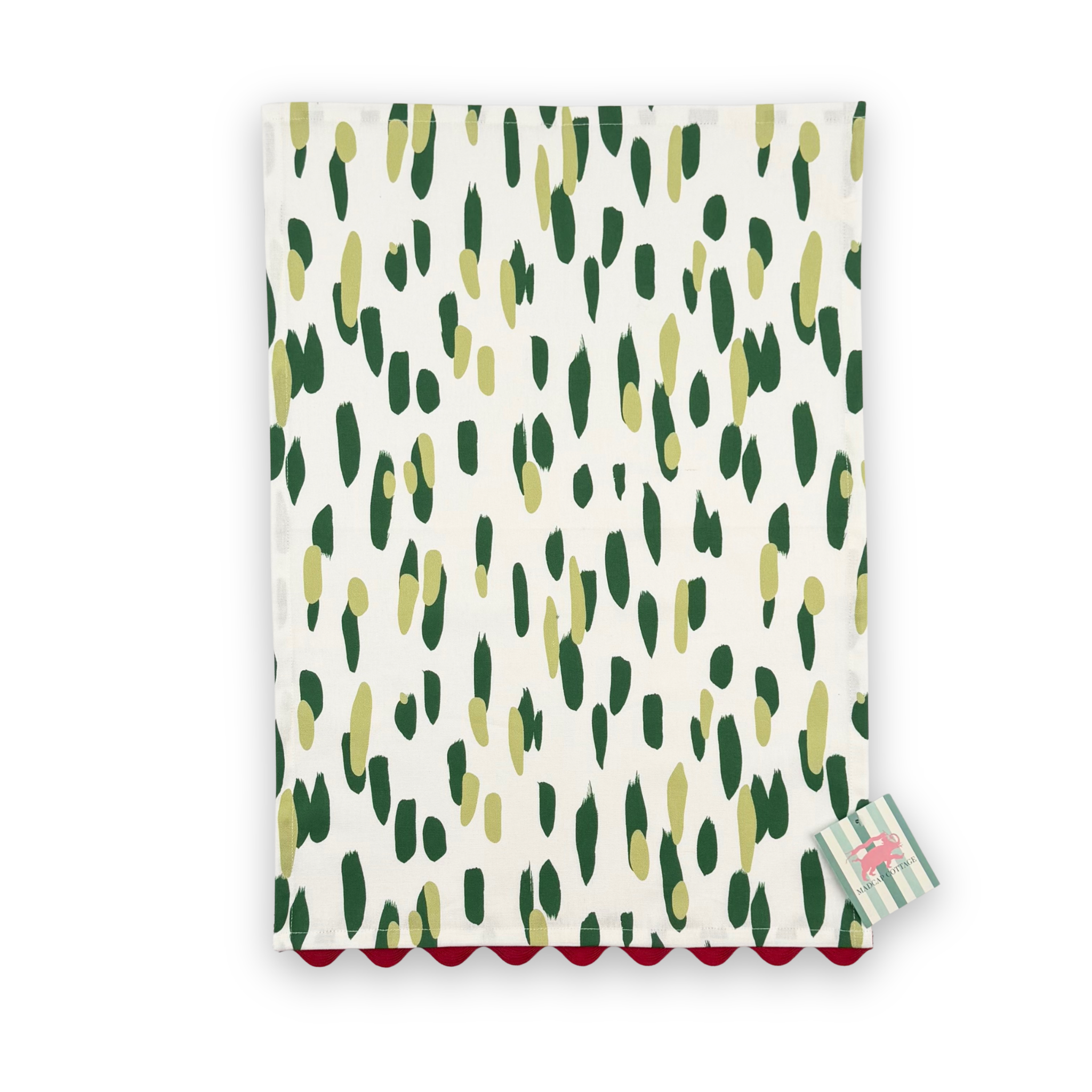 Madcap Cottage Club House cotton tea towel featuring abstract dark green and olive brushstrokes on a white background with red scalloped trim.