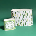 Empty duo of Club House meadow green caddies in large and small on a green background