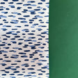 A roll of wrapping paper in painterly patterns and blue in color.