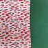 A roll of wrapping paper in painterly patterns and red in color.