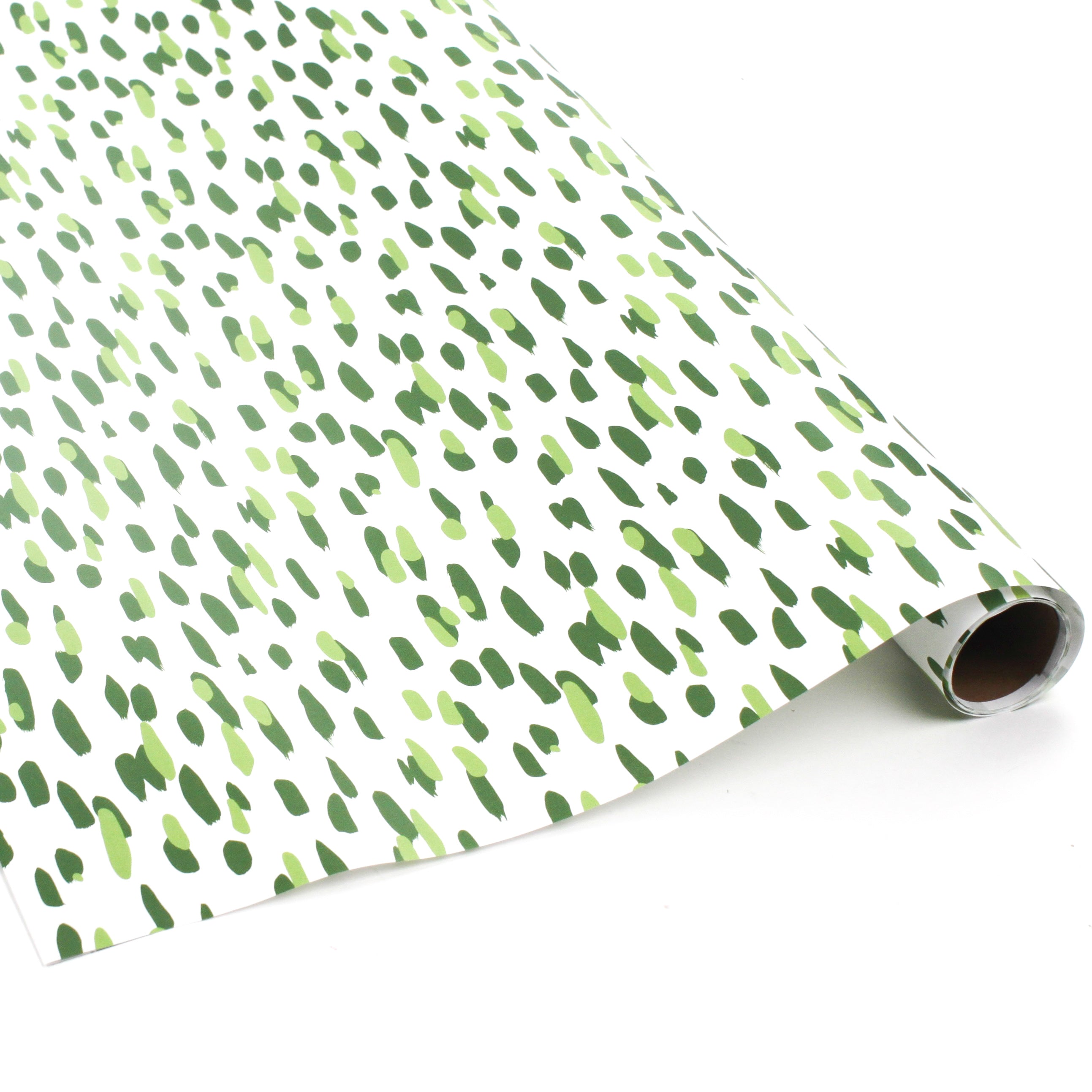 A roll of wrapping paper in painterly patterns and green in color.