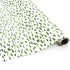 A roll of wrapping paper in painterly patterns and green in color.