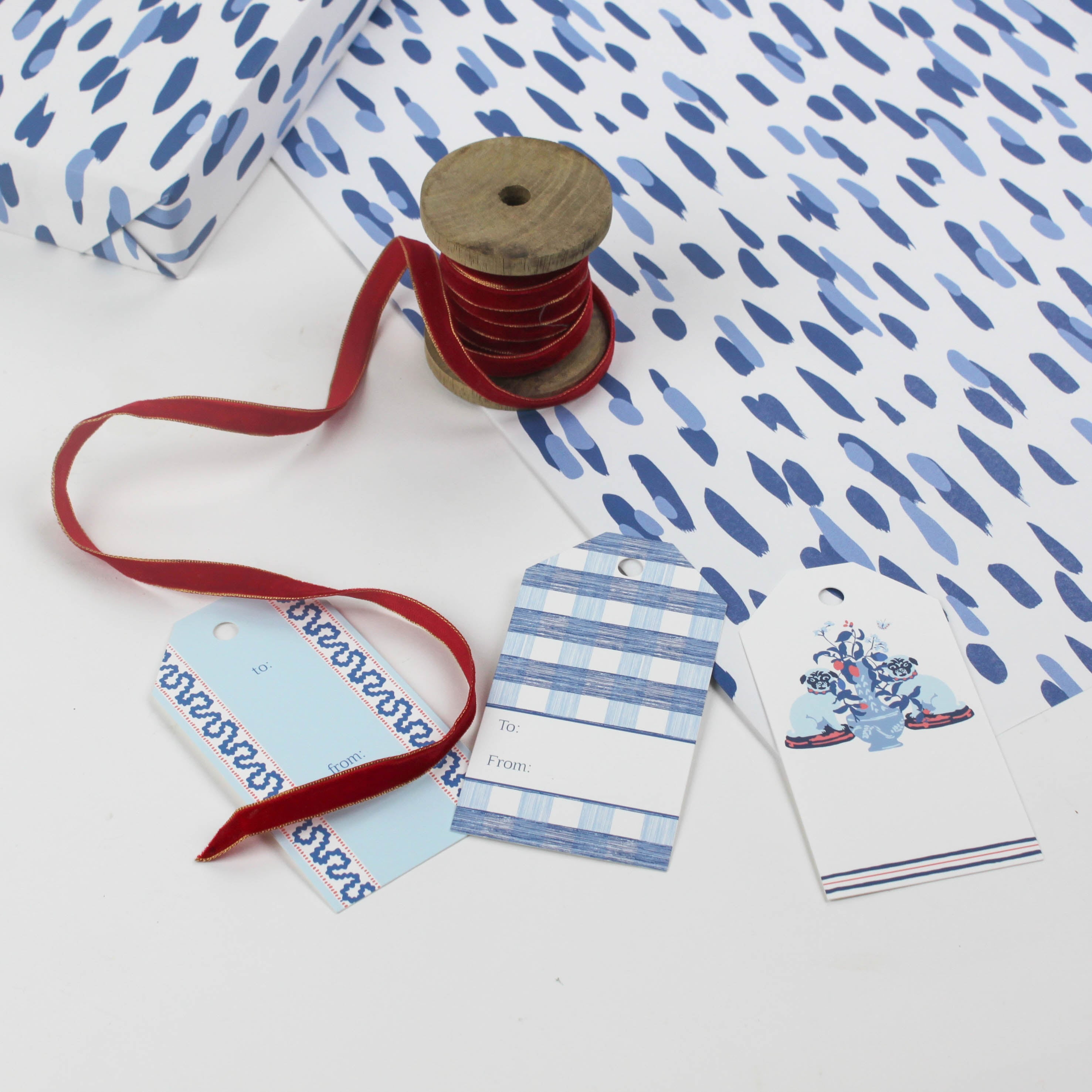 A wrapping paper in painterly patterns and blue in color.