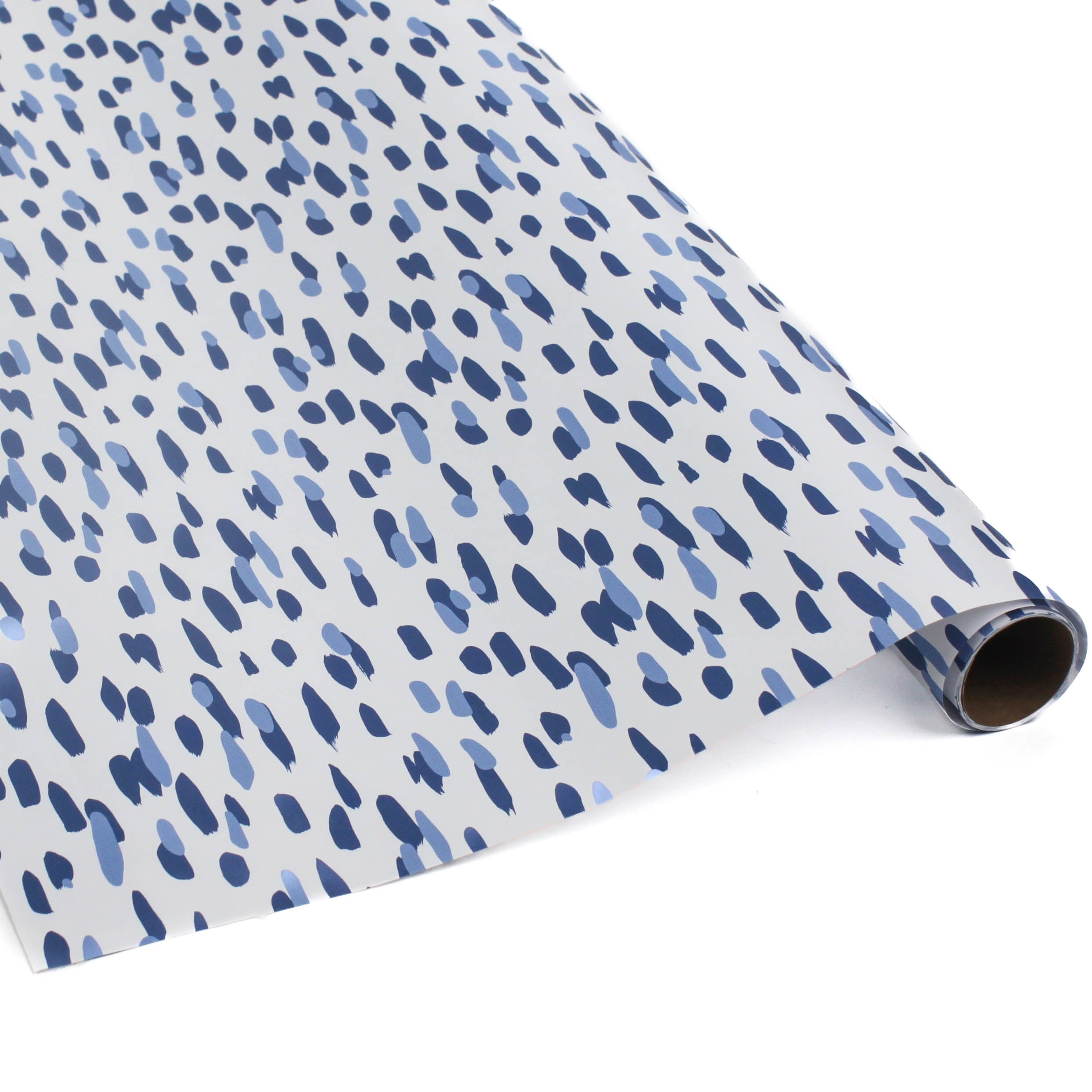 A roll of wrapping paper in painterly patterns and blue in color.