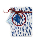 A wrapping paper in painterly patterns and blue in color.