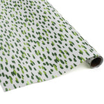 A roll of wrapping paper in painterly patterns and green in color.