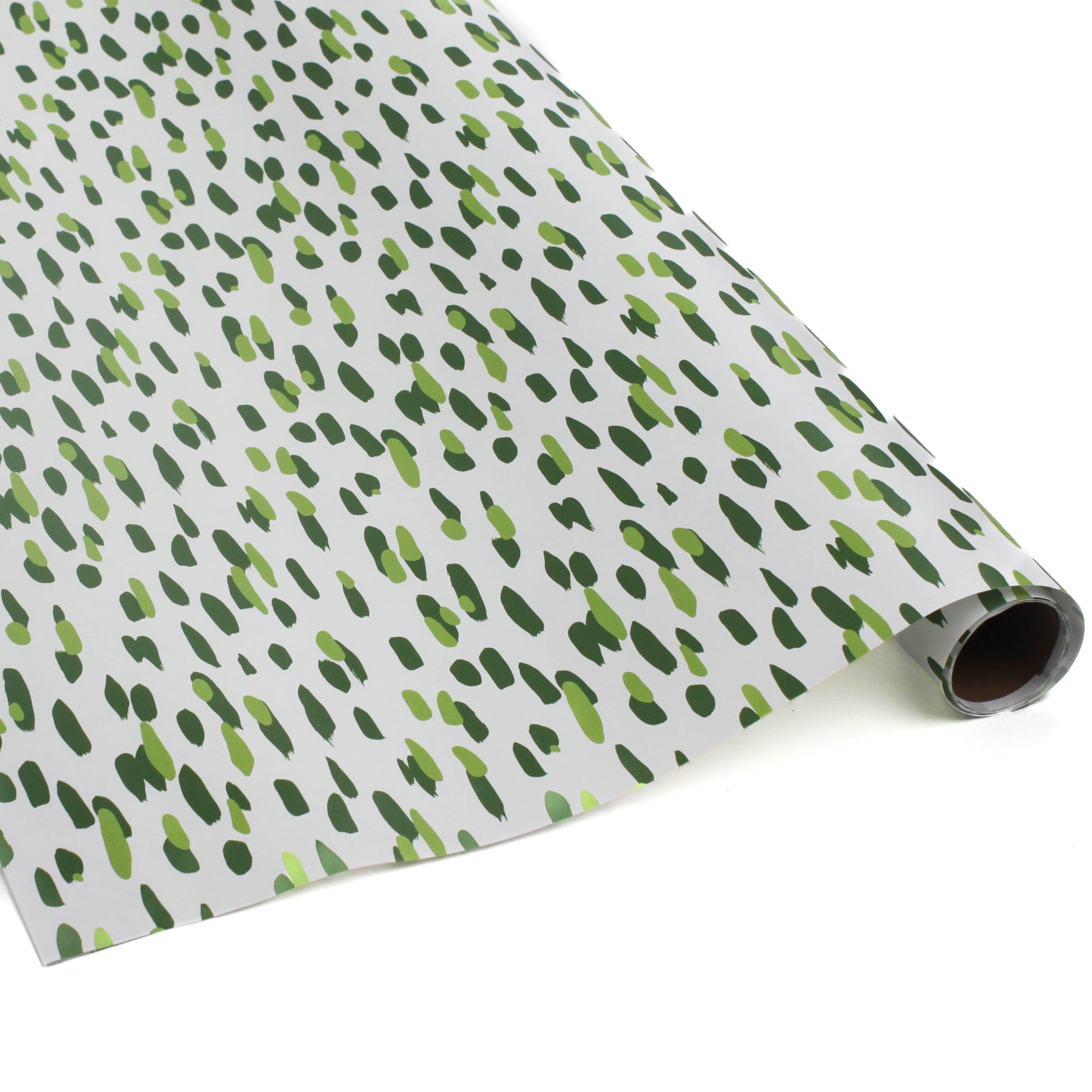 A roll of wrapping paper in painterly patterns and green in color.