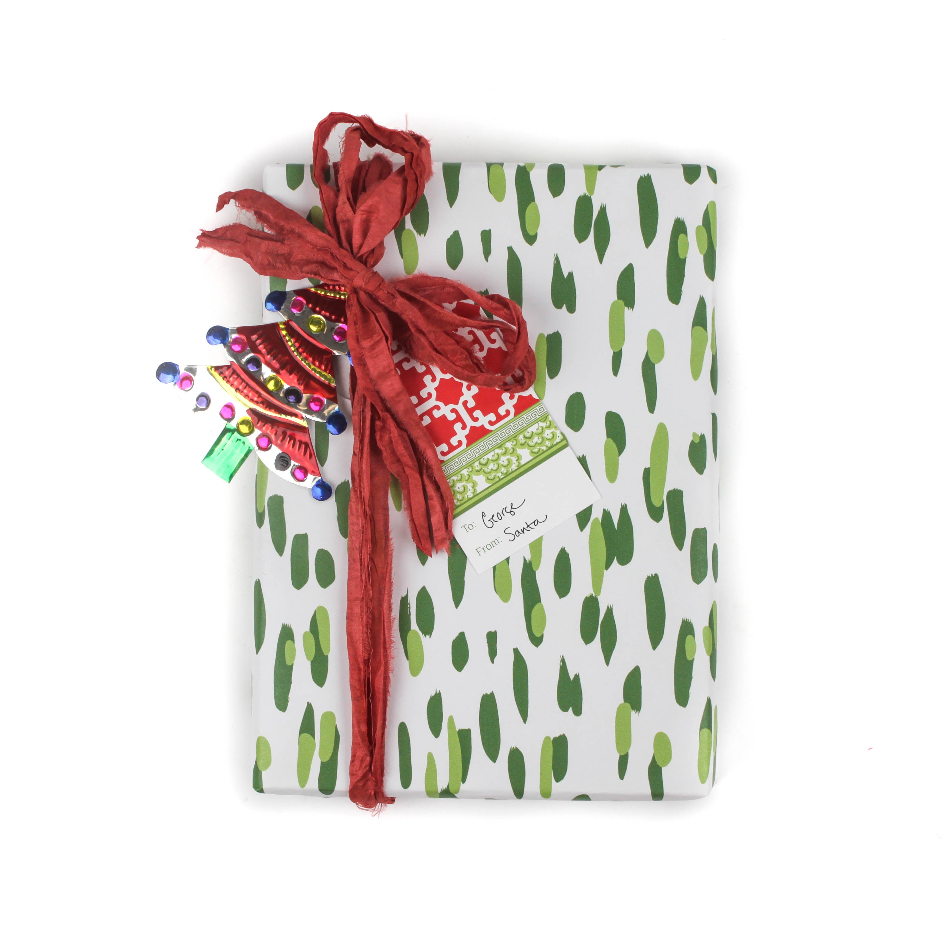 A wrapping paper in painterly patterns and green in color.