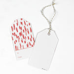 red and white gift tags with a red brushtroke pattern and a white space at the bottom that reads To: and From: