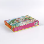 Coast of Italy 1000-piece jigsaw puzzle by Michael Storrings, illustrated puzzle box featuring a colorful Italian seaside town with beachgoers, houses, and ocean scenery.