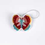 A beaded butterfly felt Christmas ornament