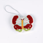 A beaded butterfly felt Christmas ornament