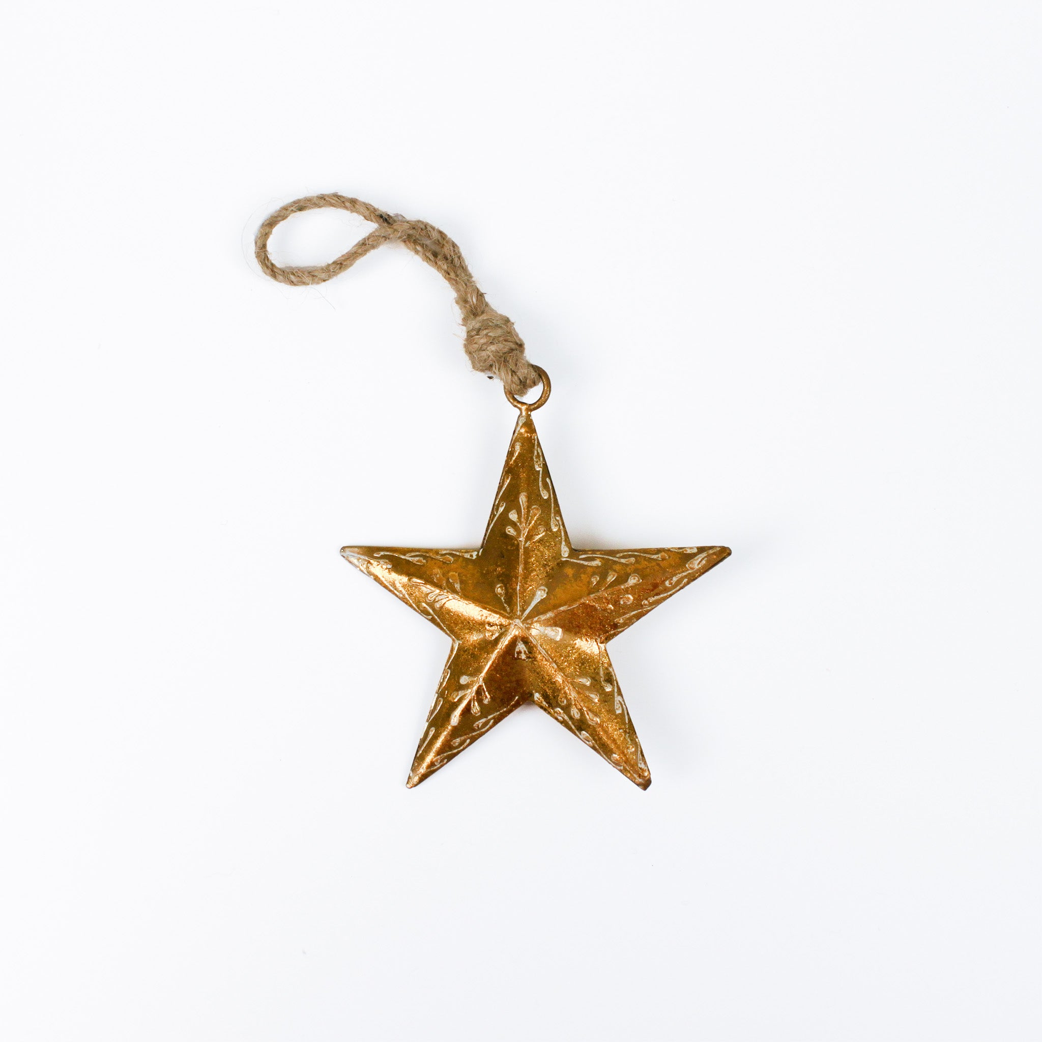 Gold star ornament with a string on a white background