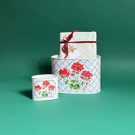 Cottage Grove Geranium filled duo of red caddies in large and small on a green background