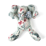 Floral patterned stuffed elephant toy with a blue and white bow.