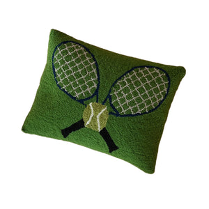 A green tennis pillow featuring a motif of crossed tennis rackets and a tennis ball