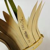 Close-up of daisy-shaped vintage wood basket showing handcrafted wooden petals and maker’s mark