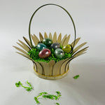 Daisy-shaped vintage wood basket styled with decorative eggs and green filler