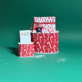 Dancing Candy Canes filled duo of Christmas caddies in large and small on a green background