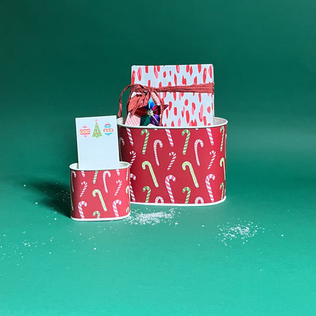 Dancing Candy Canes filled duo of Christmas caddies in large and small on a green background