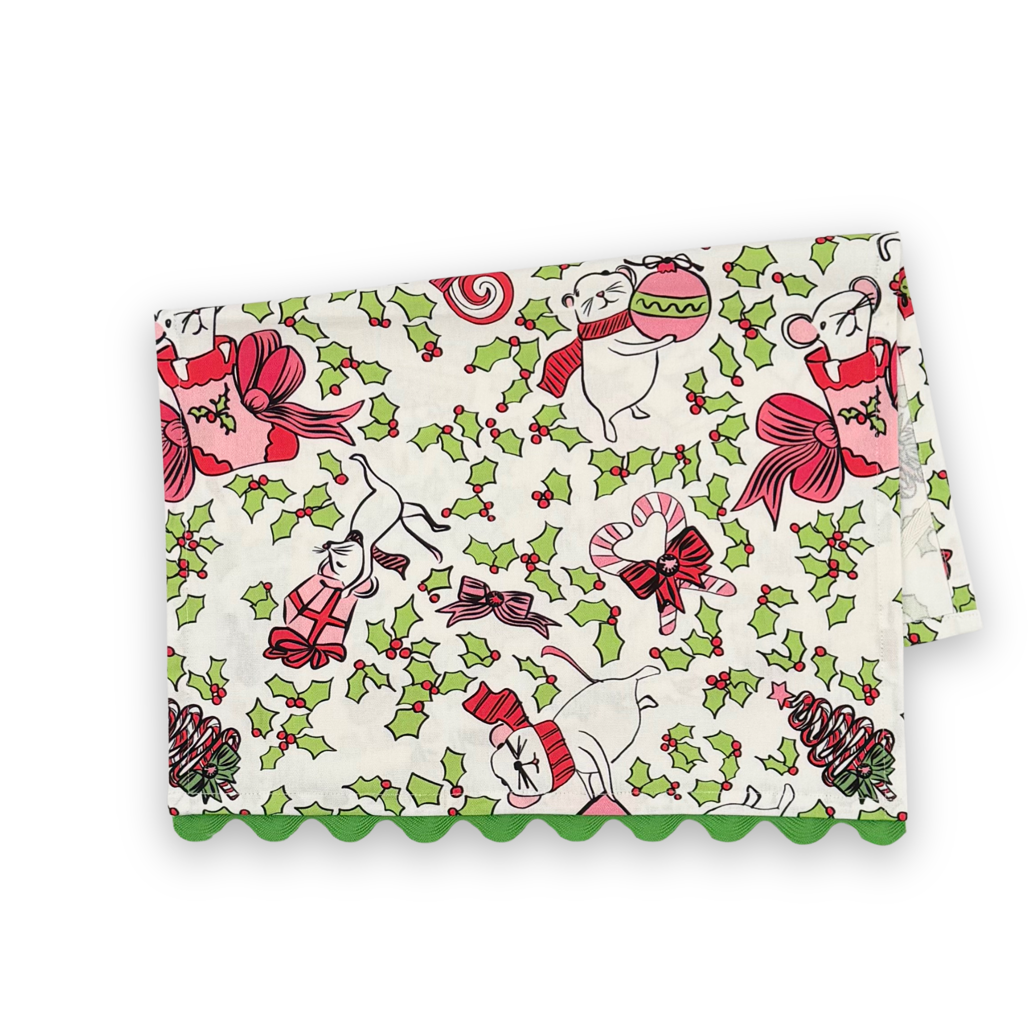 Folded Dancing Mice Christmas cotton tea towel featuring playful holiday mice, festive gifts, candy canes, green holly leaves, and green scalloped trim.