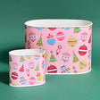 Empty duo of Darling Ornaments Christmas caddies in large and small on a green background