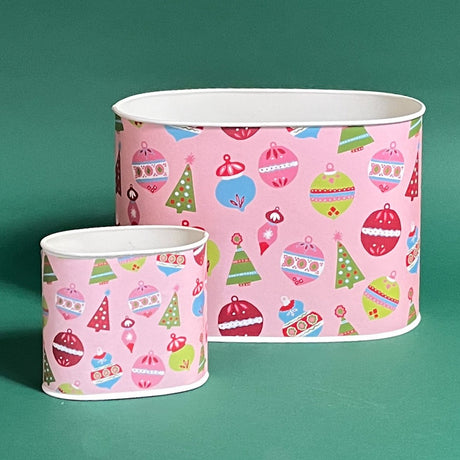 Empty duo of Darling Ornaments Christmas caddies in large and small on a green background