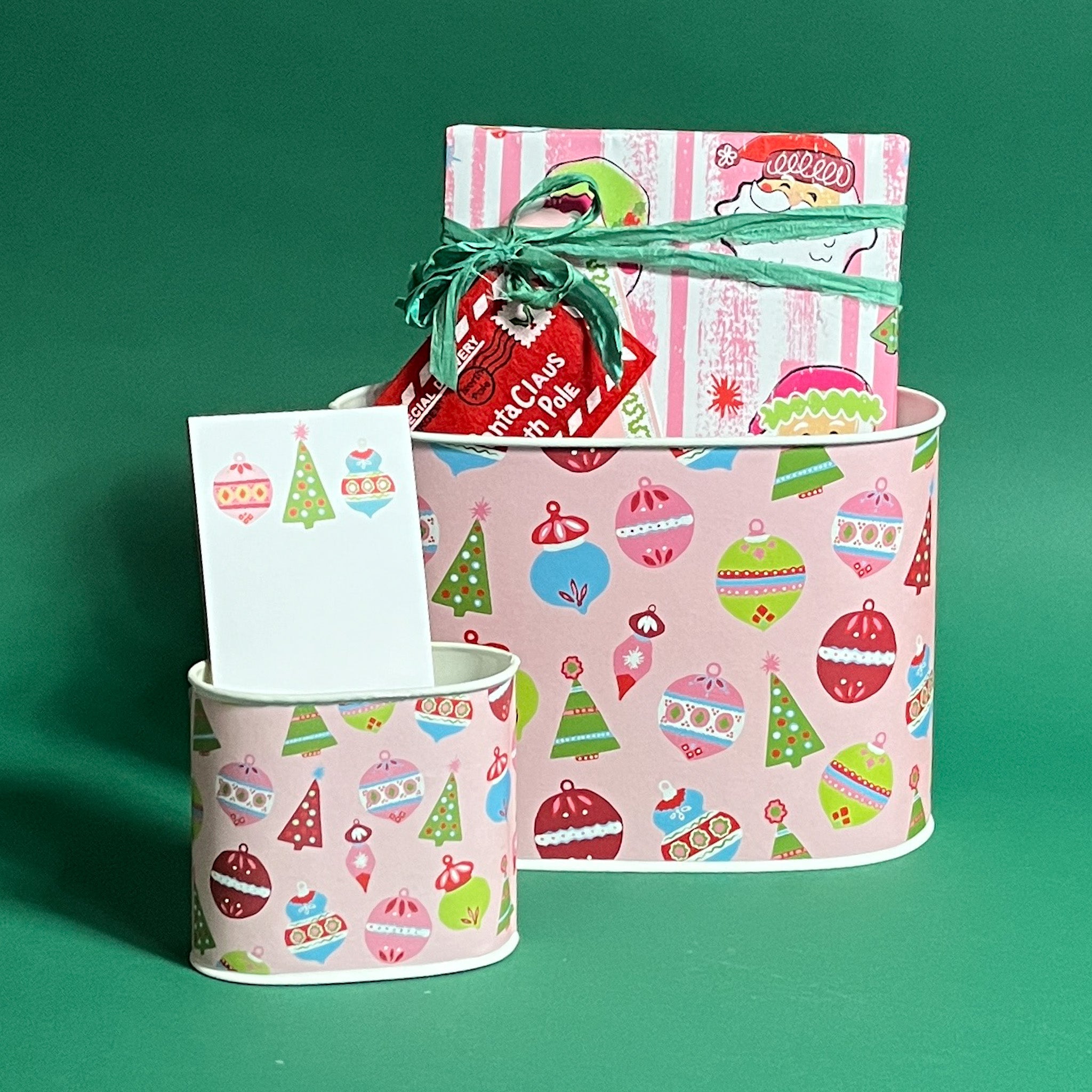  styled Darling Ornaments Christmas caddies in large and small on a green background