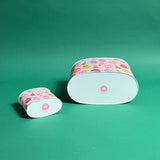Darling Ornaments Christmas caddy bottom view in large and small on a green background