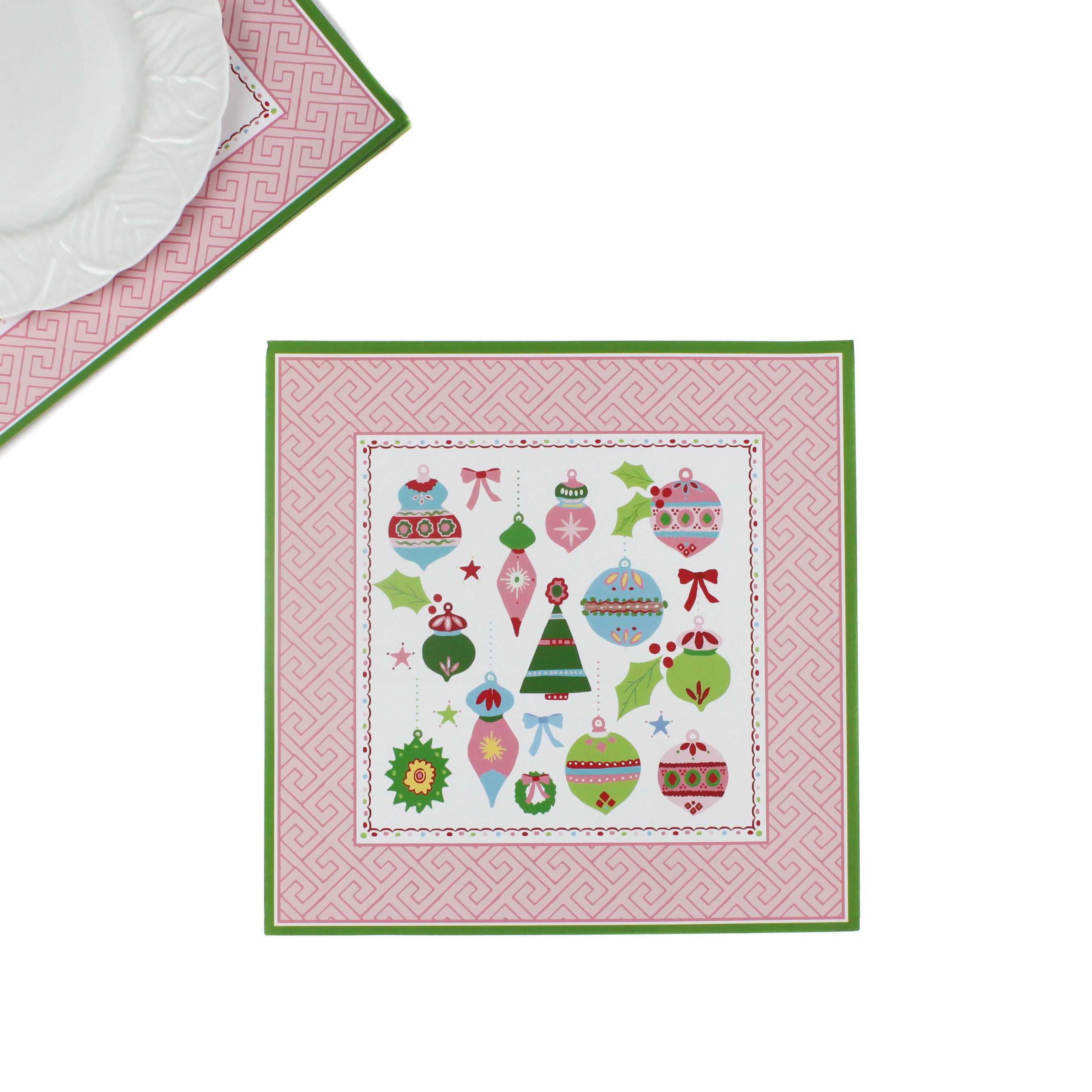 square pink paper placemats with colourful ornaments motifs in the center surrounded by a pink and green border. 