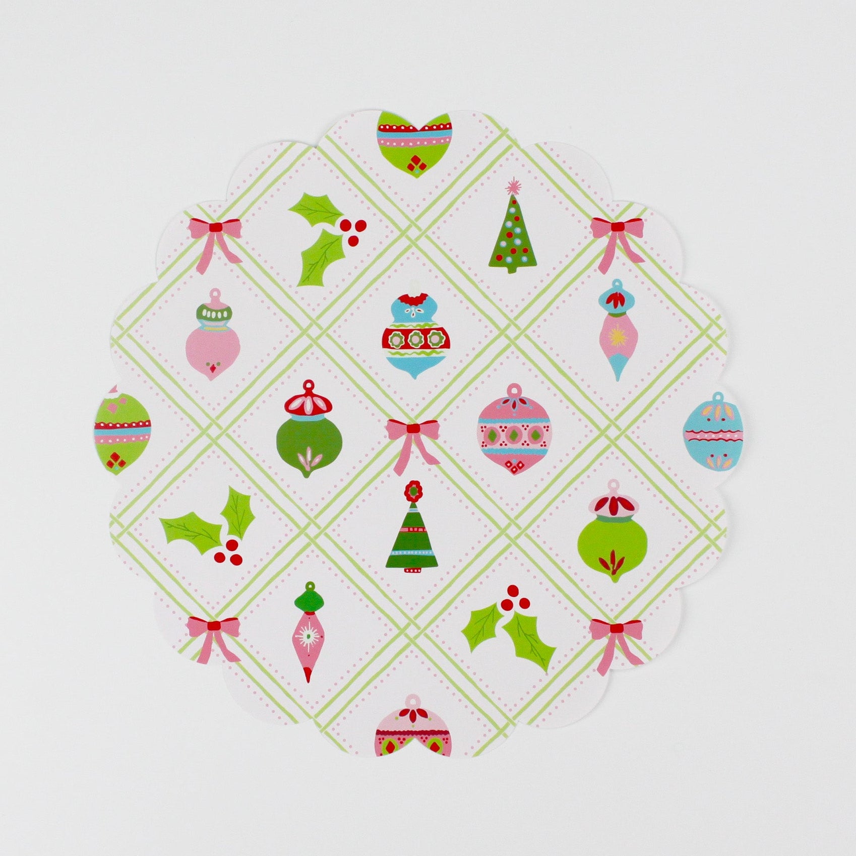A round paper christmas doily with a christmas ornament pattern from Madcap Cottage. 