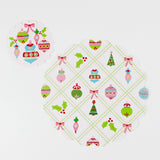 A round paper christmas doily with a christmas ornament pattern from Madcap Cottage. 