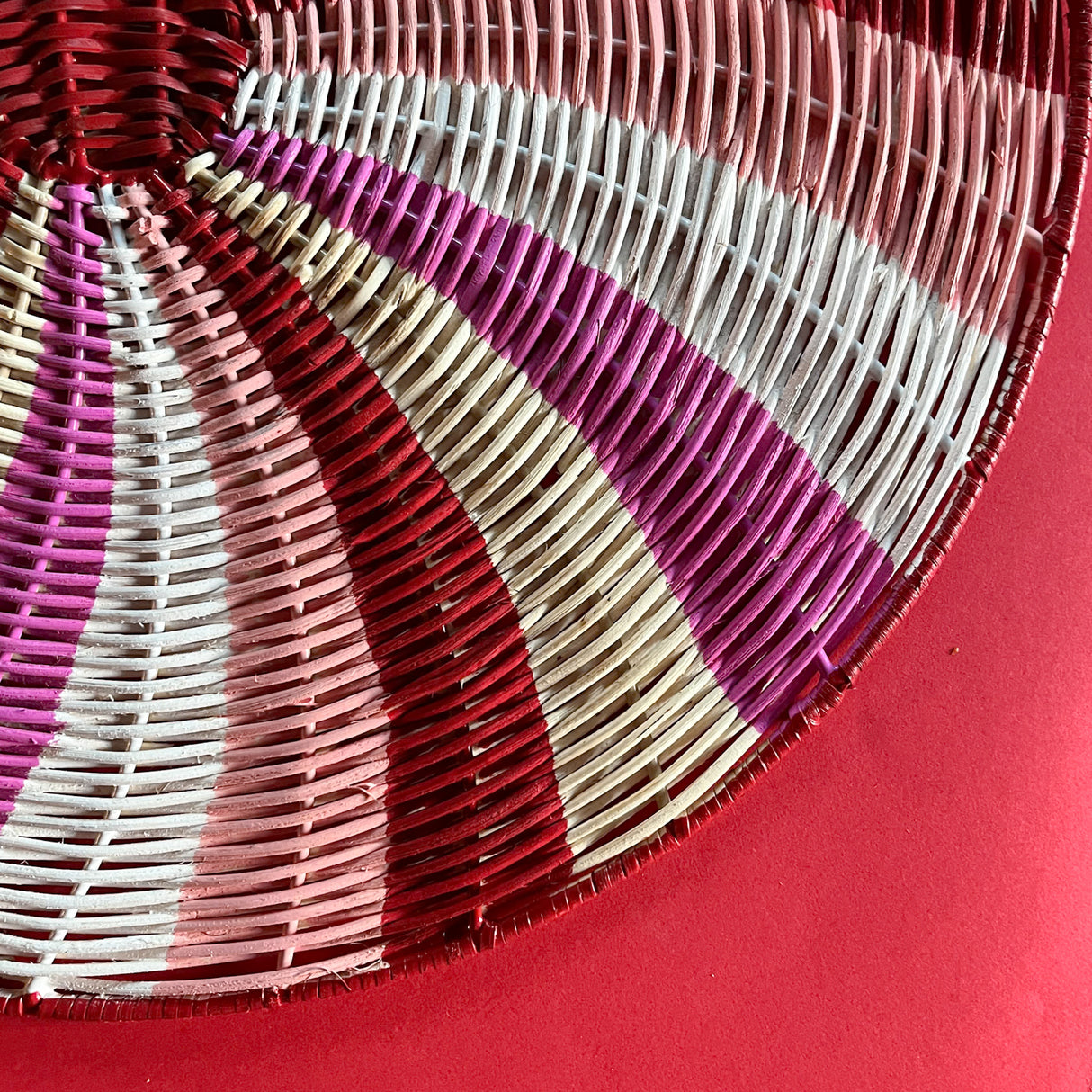 Close up view of the handpainted peppermint rattan charger/placemat