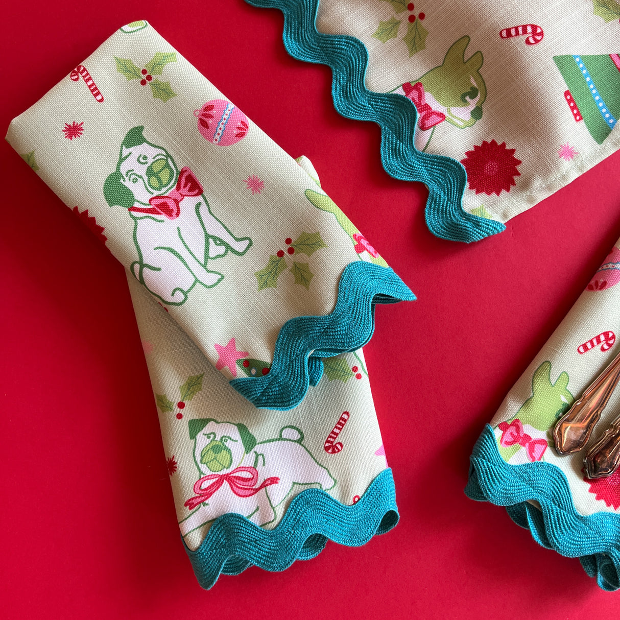 Detail view of Pug Perfection Christmas cloth dinner napkins with ric rac trim