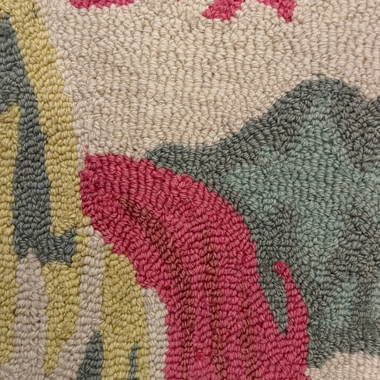 a close up of an Old Peking pink and green rug with chinoiserie motifs from madcap cottage