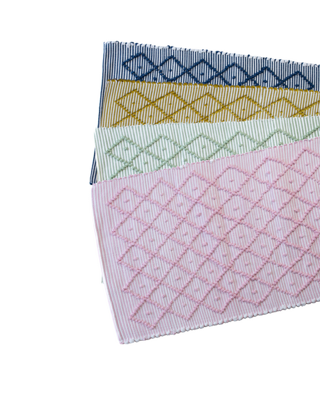 4 cotton accent rugs in blue, yellow, green and pink with a repeating diamond motif from madcap cottage