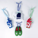 felt chinoiserie Christmas ornaments including a blue ginger jar, red ginger jar green loafers, and elephant on a white background.