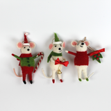 Three festive felt mouse ornaments dressed in holiday outfits with a white background