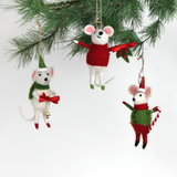 Three festive felt mouse ornaments dressed in holiday outfits hanging in a christmas tree