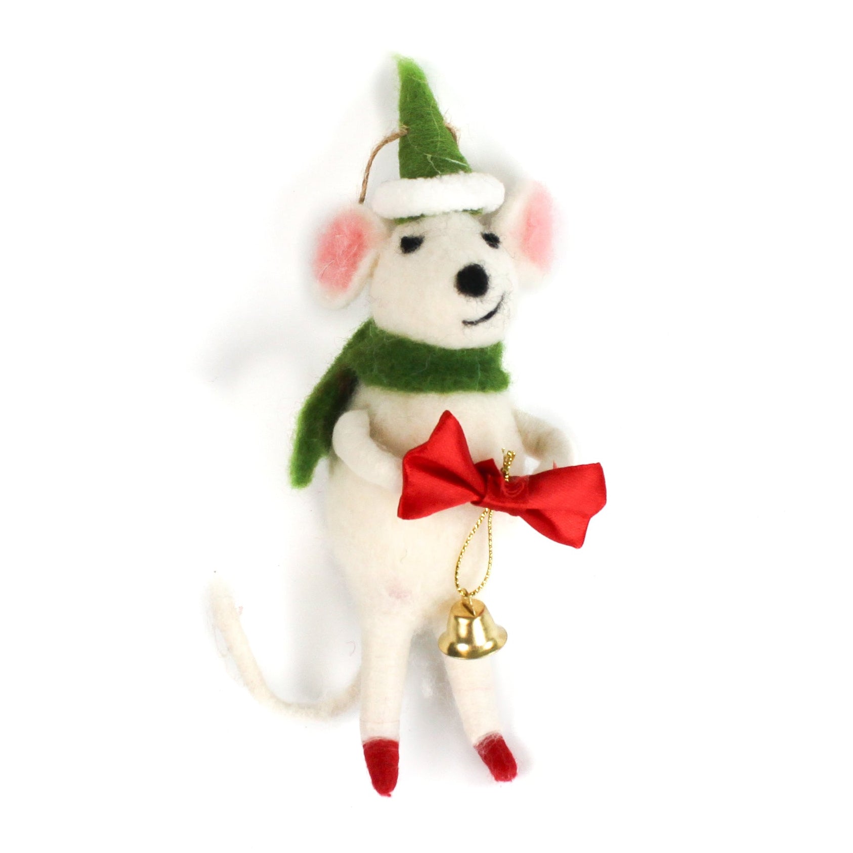 A felt mouse ornament wearing a green scarf and hat holds a red bow with a small gold bell hanging from it.
