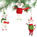 Three festive felt mouse ornaments dressed in holiday outfits hanging in a christmas tree