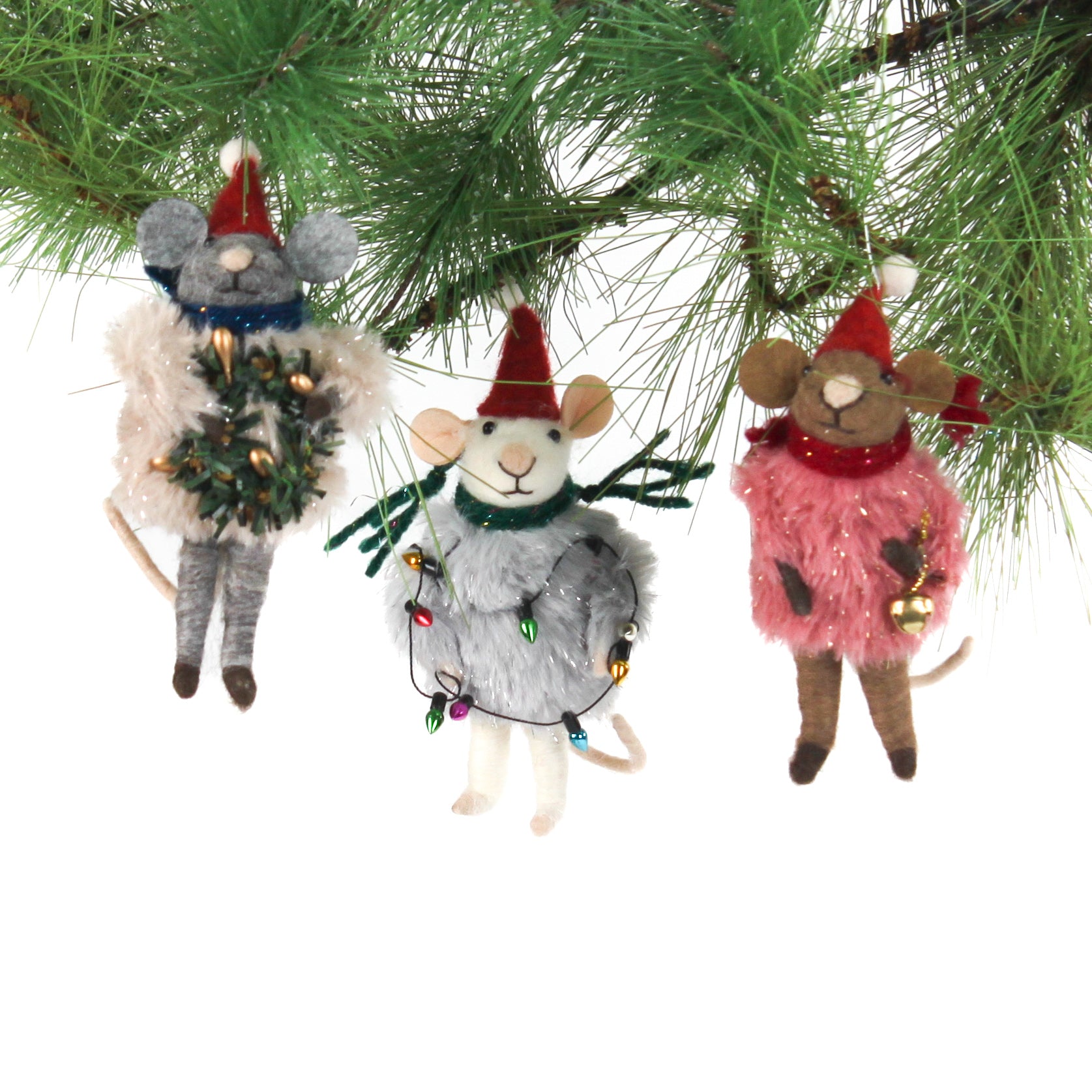 Three festive felt mouse ornaments dressed in fuzzy holiday outfits and Santa hats, holding Christmas decorations like string lights, a wreath, and a gold bell.